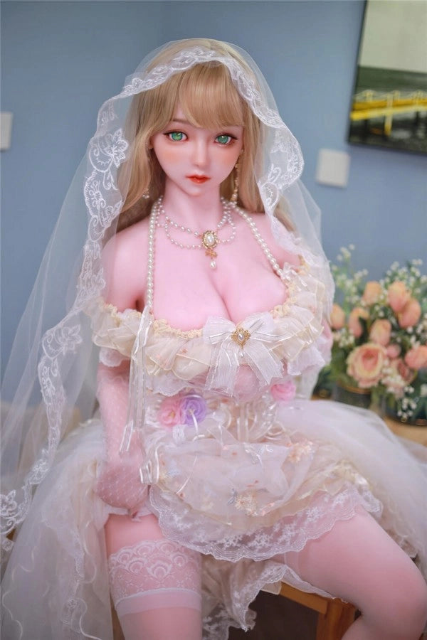 Sexpuppe in Brautkleid sitzend