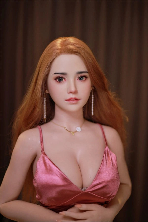 Frau aussehende Sexpuppe in Kleid