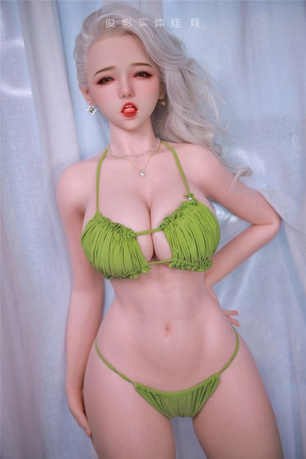 Sexpuppe in grünem Bikini