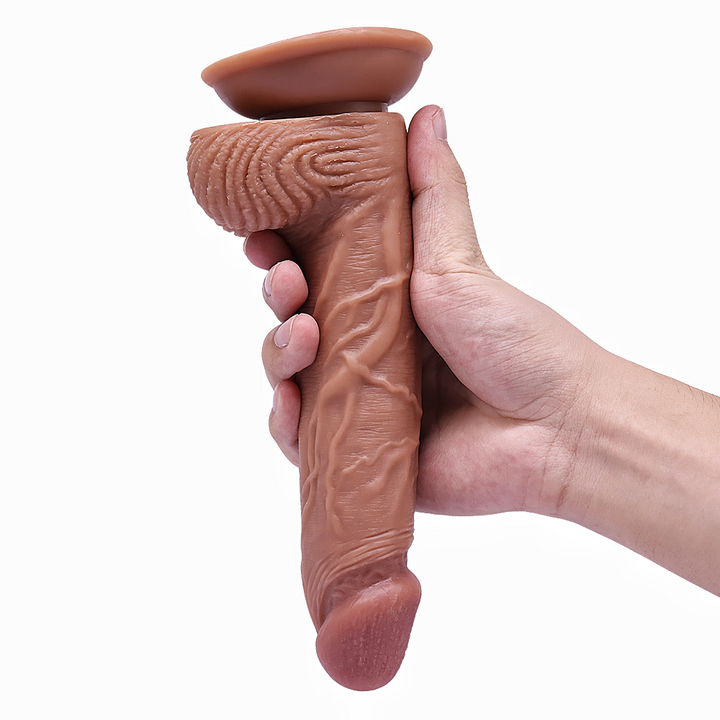 Hand hält realistischen Dildo