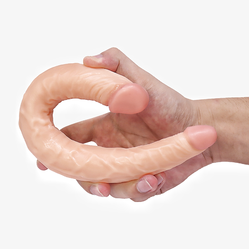 Hand hält flexiblen Dildo